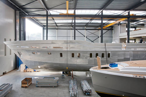 2 boats in a warehouse