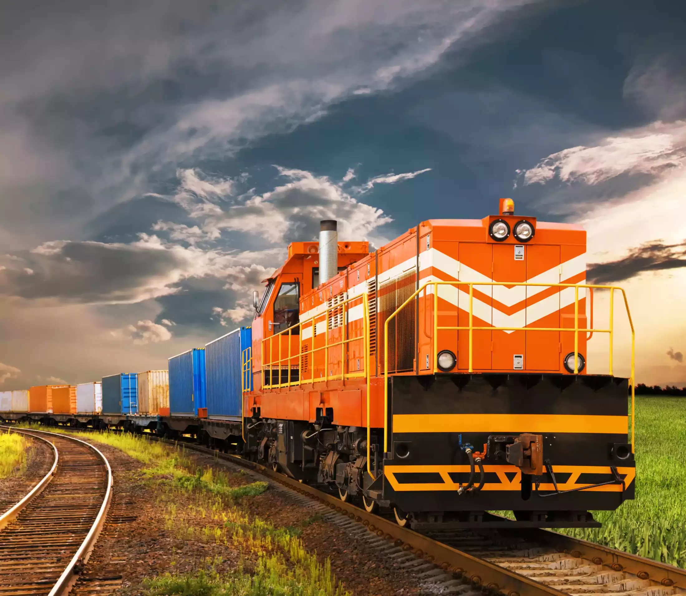 A train on the tracks after being manufactured in a facility with solutions for dust collection for railway equipment