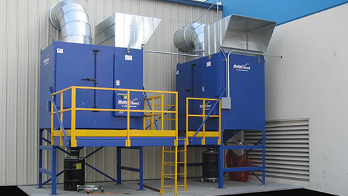 Outdoor RoboVent dust collection with platform access.