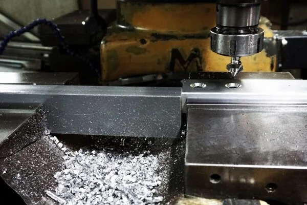Aluminum drilling rig with an aluminum dust collection system in place