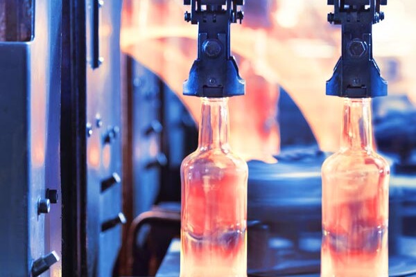 Glass bottles being manufactured with no dust due to industrial dust collection system