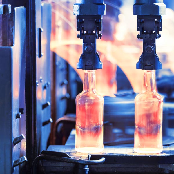Glass bottles being manufactured with no dust due to industrial dust collection system