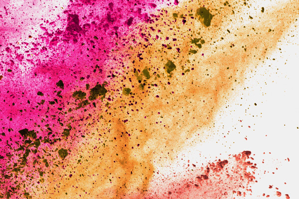 Pink, yellow, and red paint being splattered