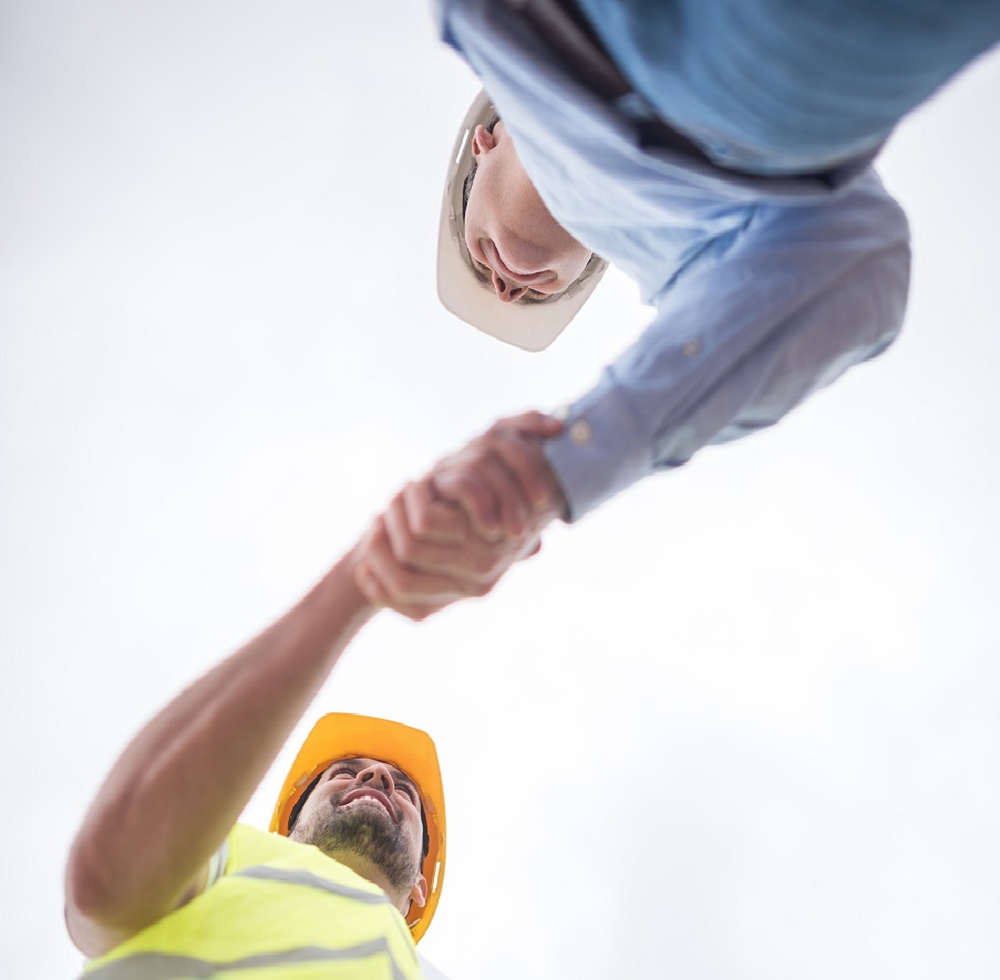 Construction workers handshaking