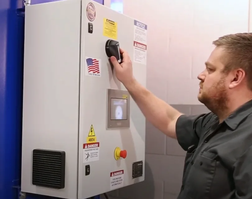 Individual using simpler controls on the Spire360 Series used for Ambient Air Filtration Systems from RoboVent