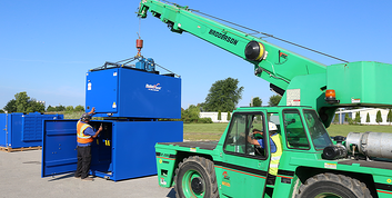 RoboVent dust collectors being prepped for installation at a facility requiring a dust collection solution for glass recycling.