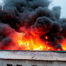 Building on fire because if an explosion, due to a metalworking dust explosion.
