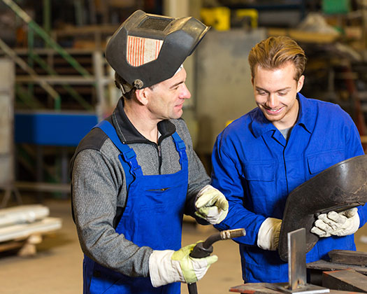 teacher and student welding